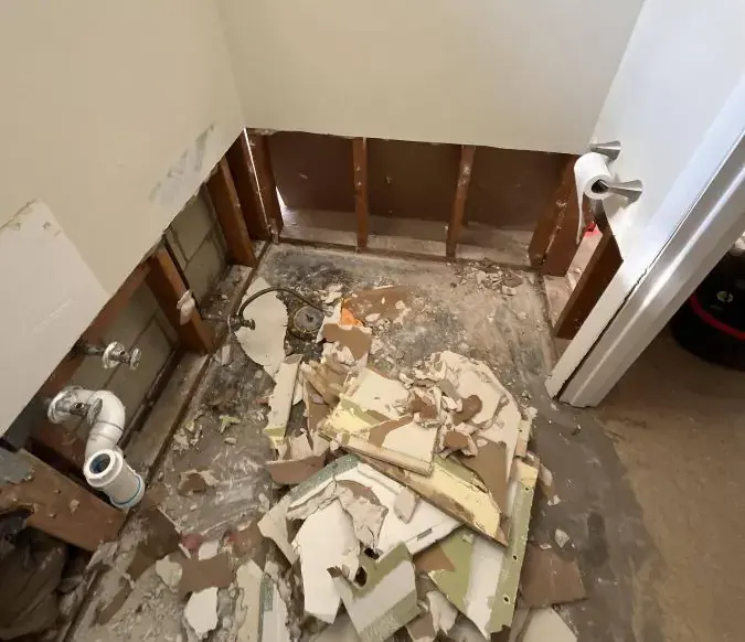 Bathroom stripped to the studs after a sewage backup cleanup